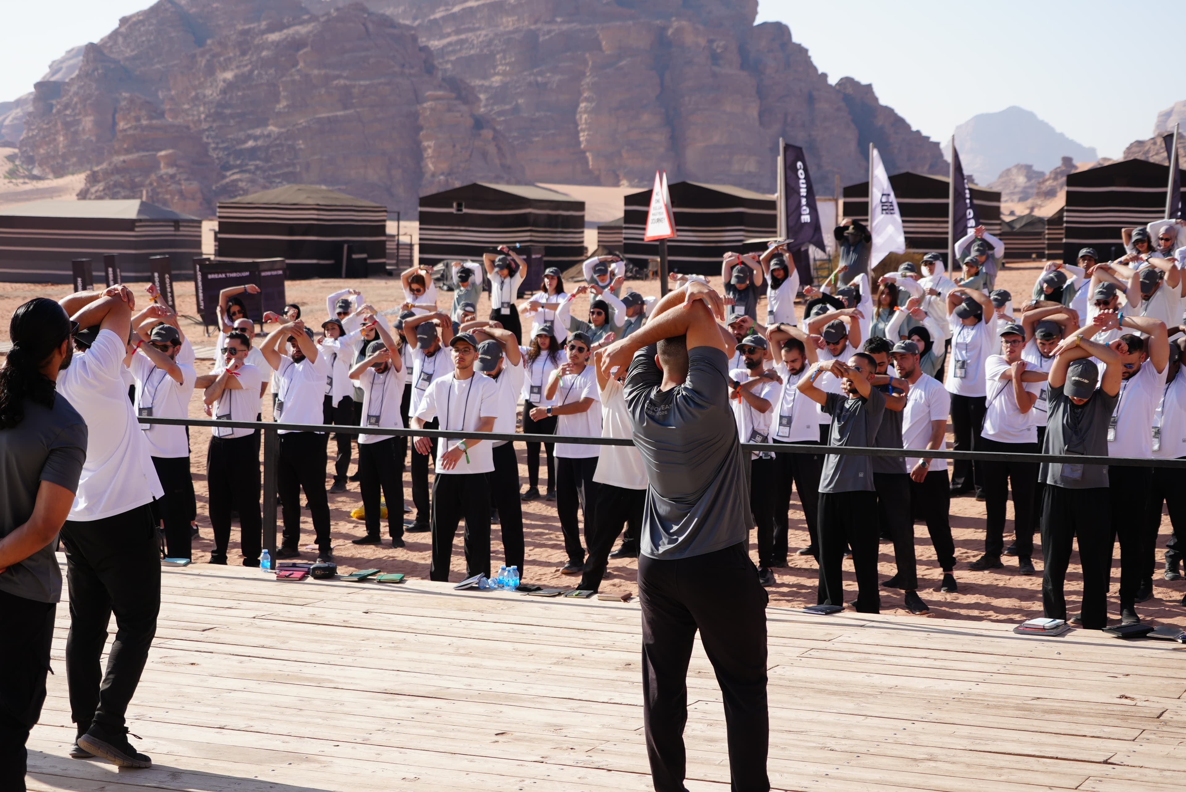 CORE leadership bootcamp participants following a guided group exercise in Wadi Rum
